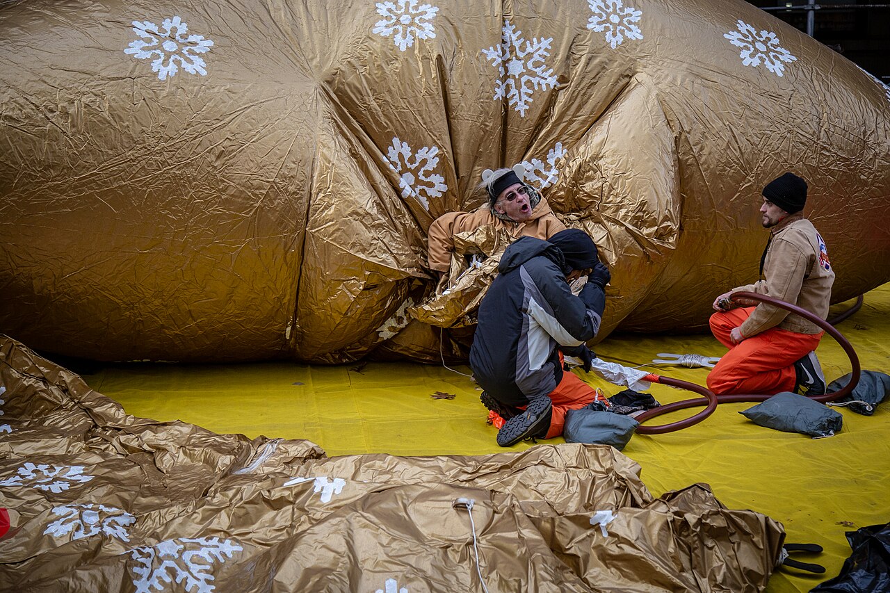 Crew members working on a partly inflated balloon at the inflation